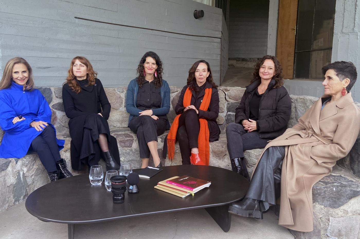 South American architects around a table in discussion
