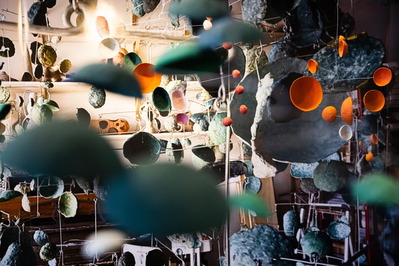 Close up view of hanging paper mobile installation in space