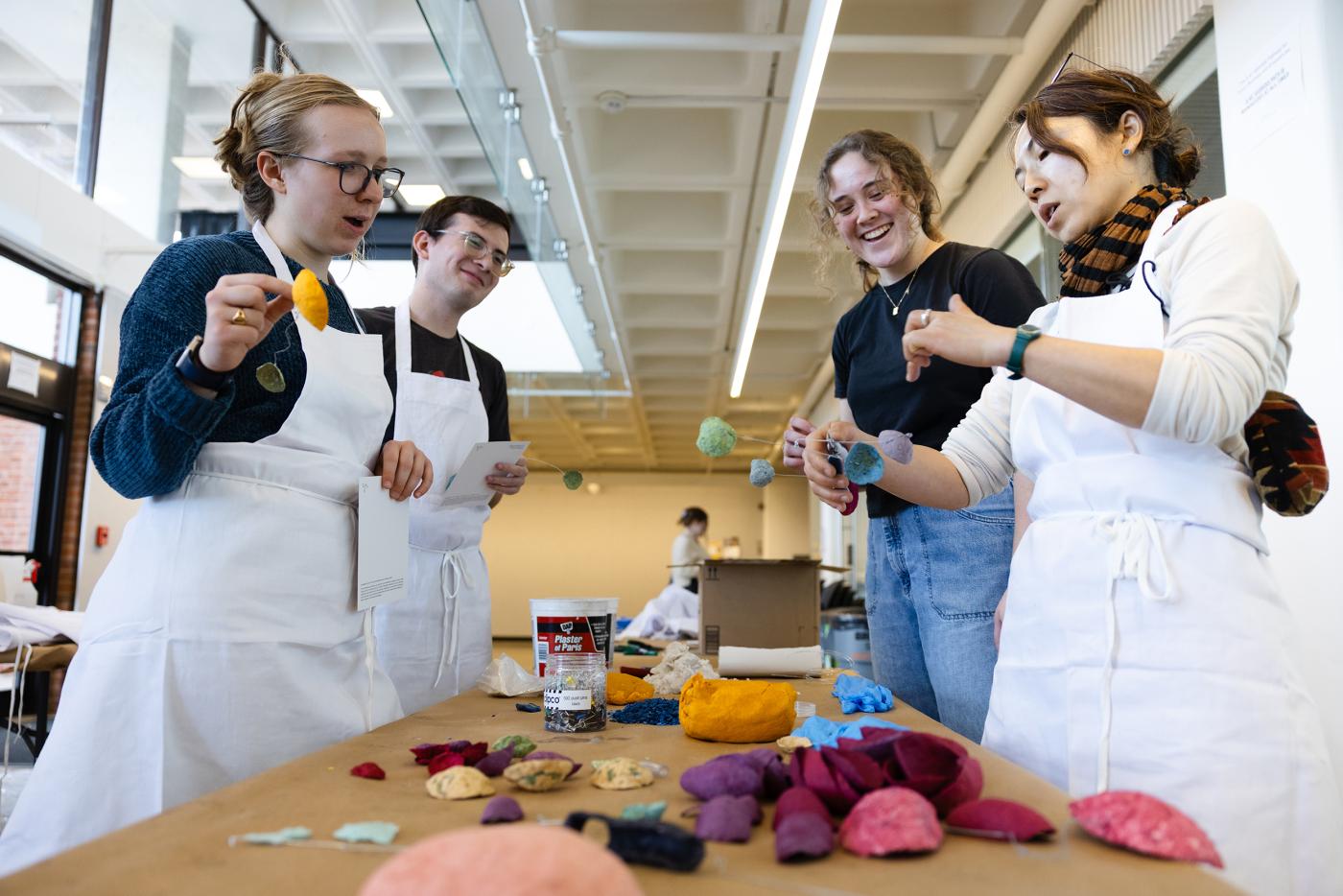Artist Yuko Nishikawa leads a workshop with students