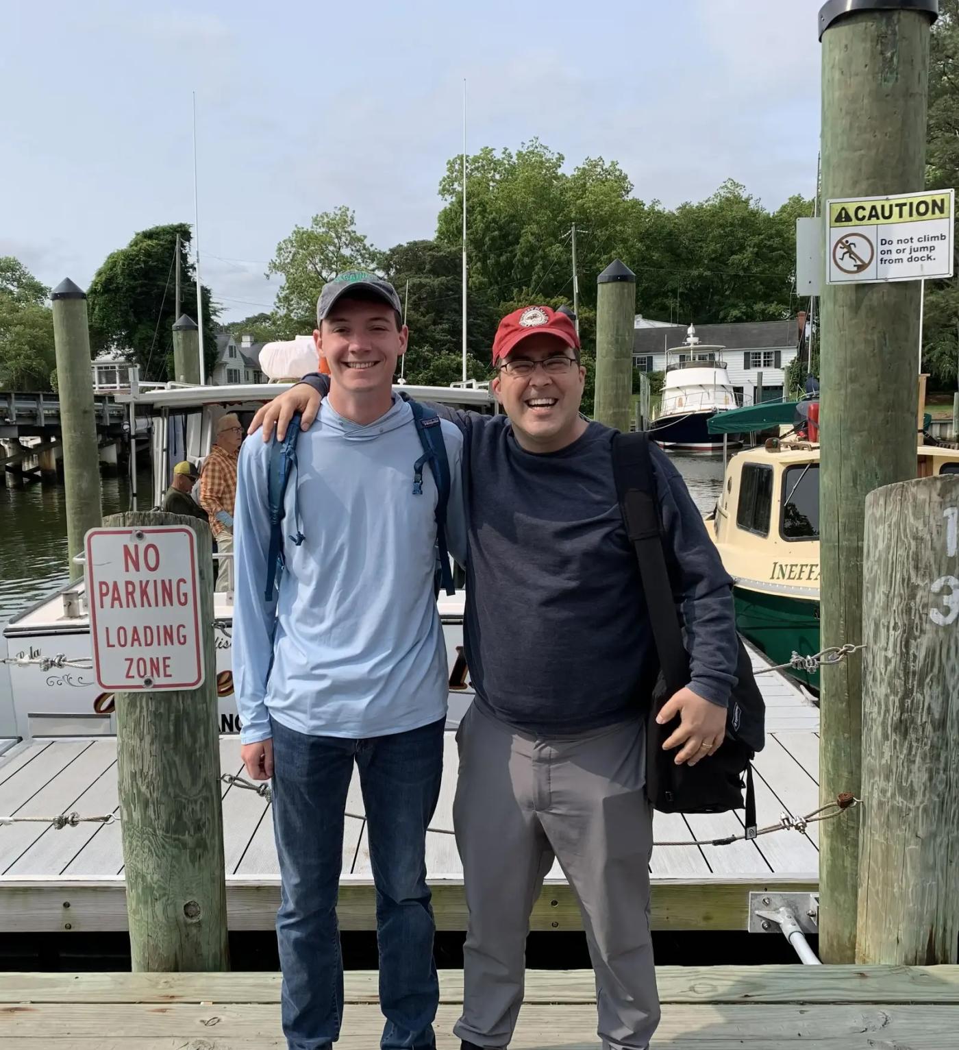 School of Architecture students, Andy Packwood and Lincoln Lewis, stand on a pier on Tangier Island. 